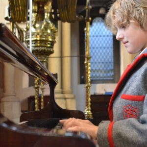 boy playing the piano