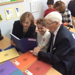 student reading with grandparent