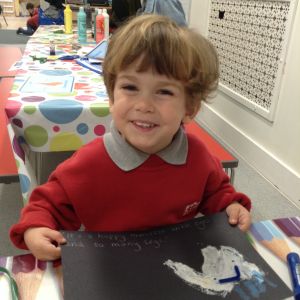 boy showing his drawing