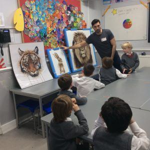 teacher pointing to drawings of animals