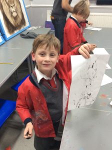 boy showing his drawing